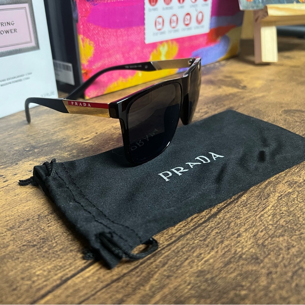 Prada Black Sunglasses with Gold and Red Temple Accents